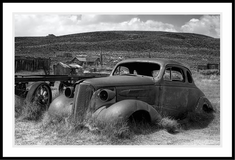 Old car in a field.